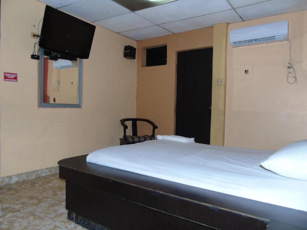 Postel nebo postele na pokoji v ubytování Hotel Imperial