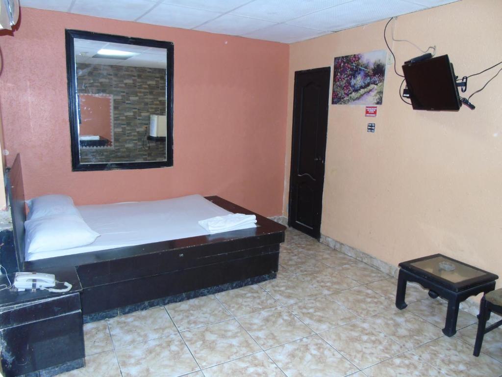 Postel nebo postele na pokoji v ubytování Hotel Imperial