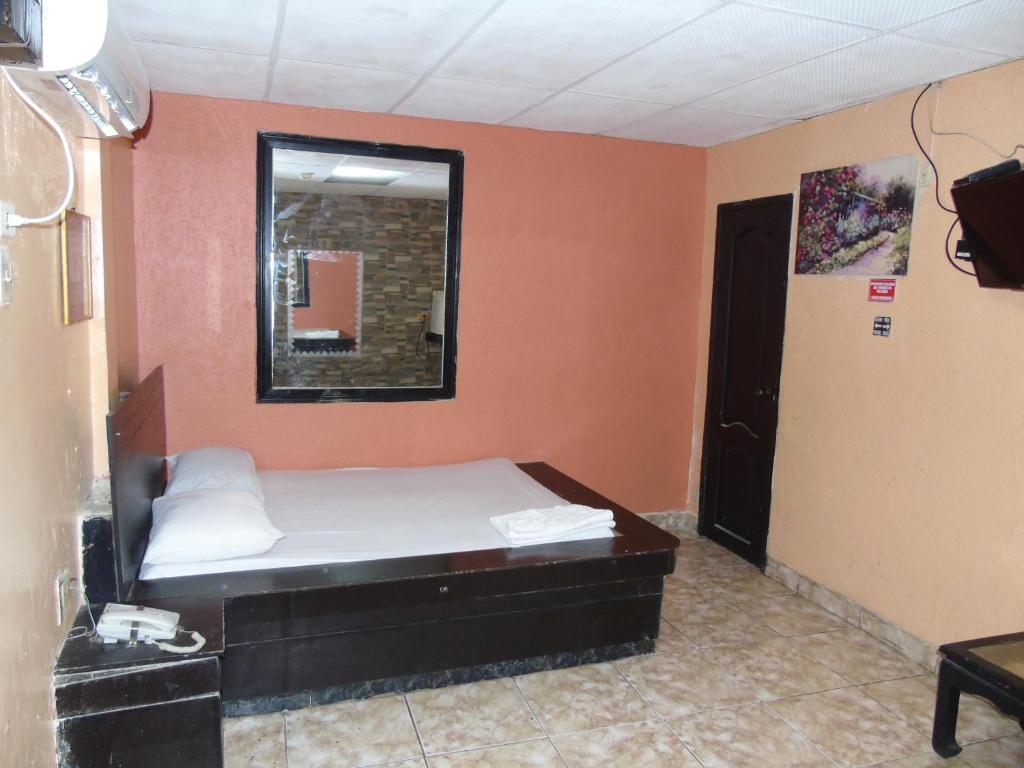 Postel nebo postele na pokoji v ubytování Hotel Imperial
