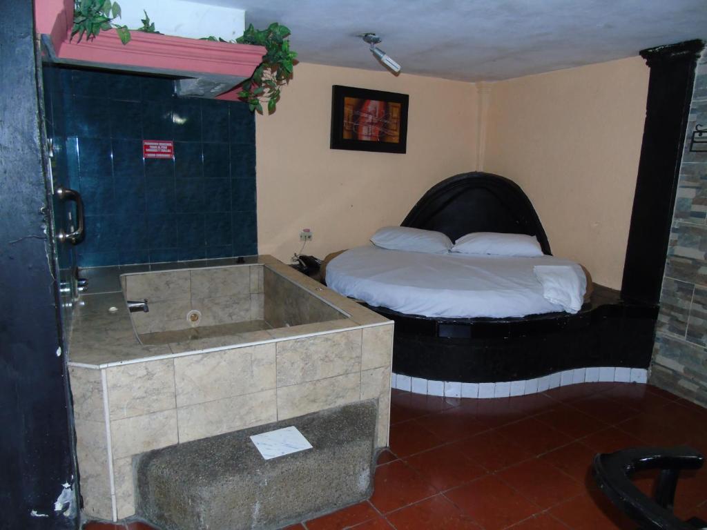 Postel nebo postele na pokoji v ubytování Hotel Imperial