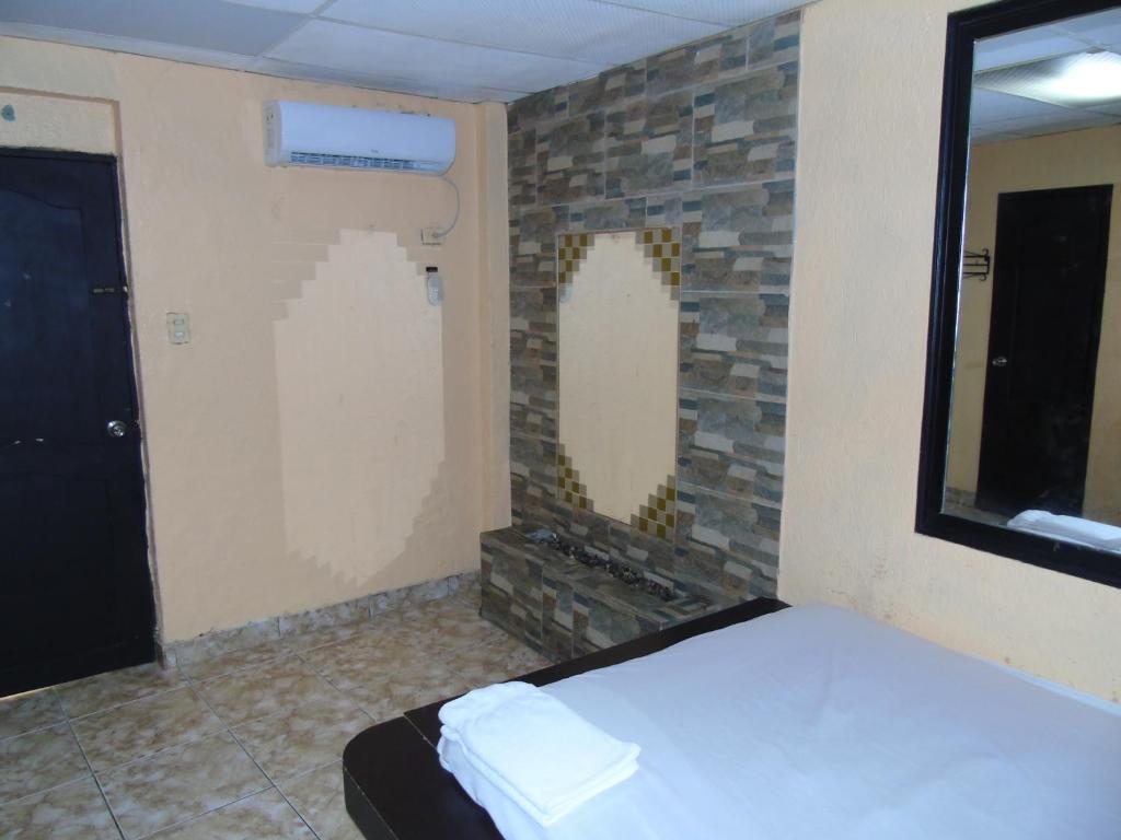 Postel nebo postele na pokoji v ubytování Hotel Imperial