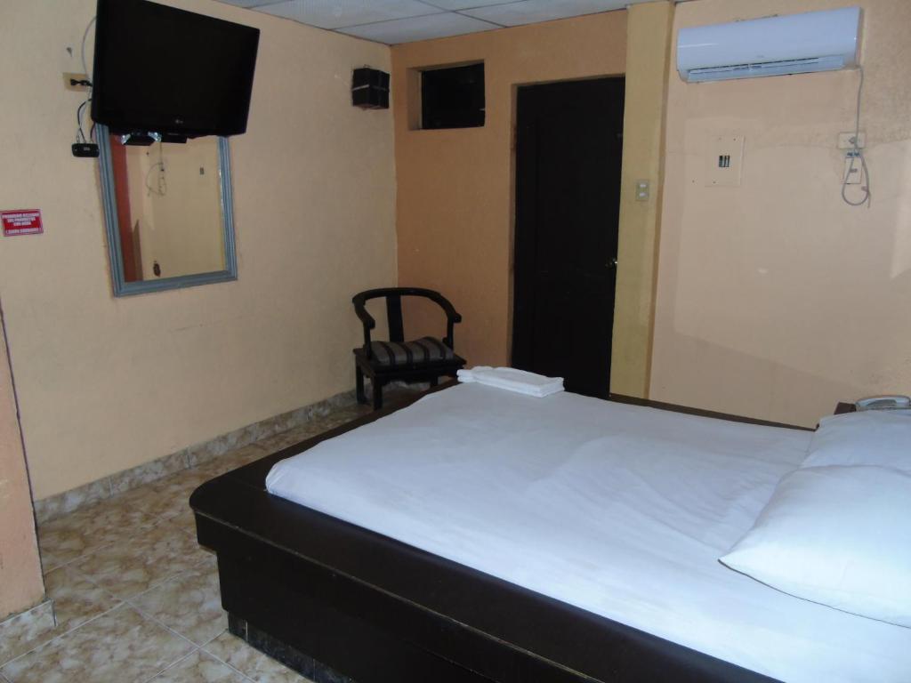 Postel nebo postele na pokoji v ubytování Hotel Imperial