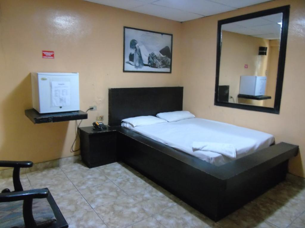 Postel nebo postele na pokoji v ubytování Hotel Imperial