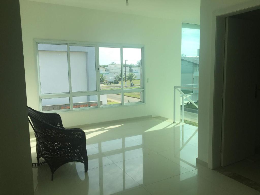  Casa Itanhaém em condomínio fechado de frente para o mar