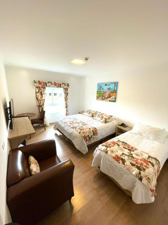 Cama ou camas em um quarto em Pousada Itália Moderna