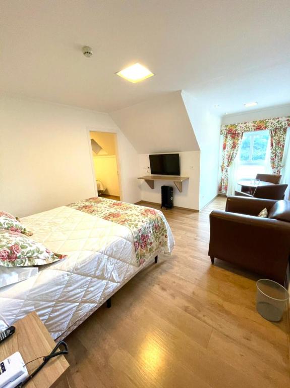 Cama ou camas em um quarto em Pousada Itália Moderna
