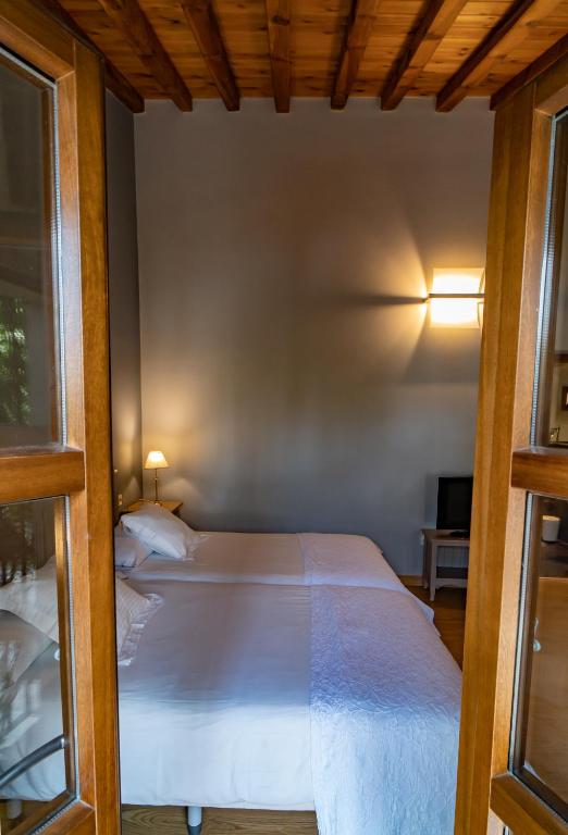 Postel nebo postele na pokoji v ubytování Hotel Alfonso IX