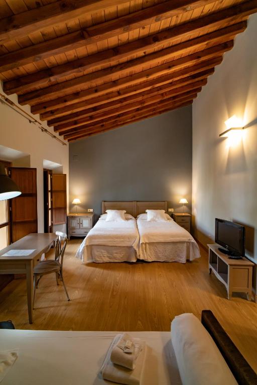 Postel nebo postele na pokoji v ubytování Hotel Alfonso IX