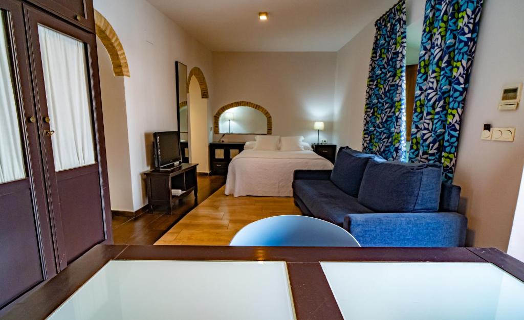 Postel nebo postele na pokoji v ubytování Hotel Alfonso IX