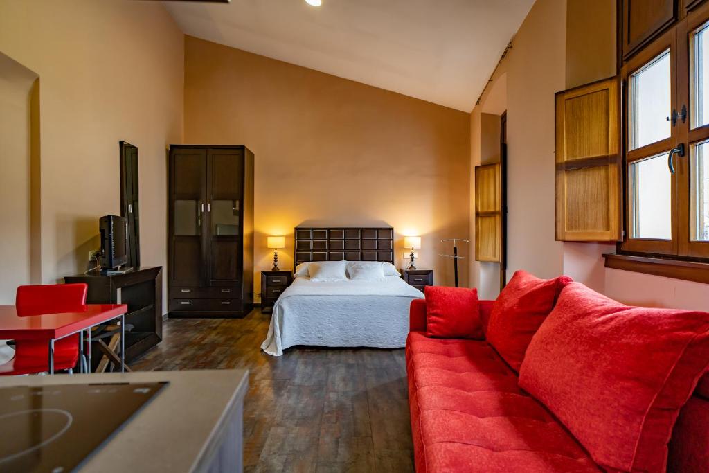 Postel nebo postele na pokoji v ubytování Hotel Alfonso IX