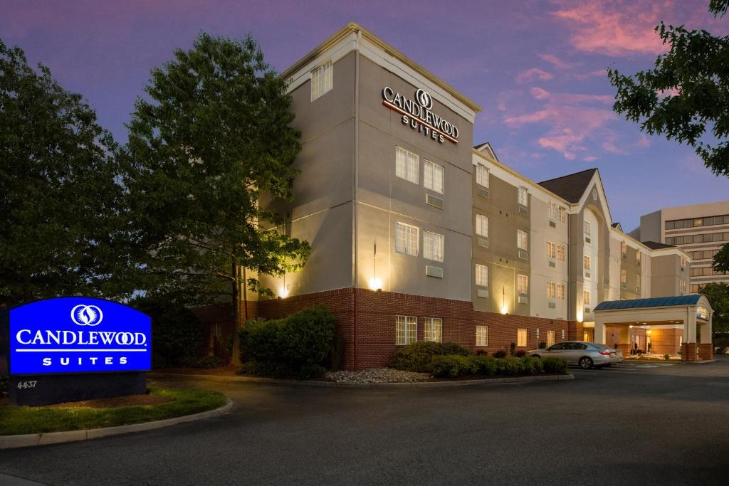 a hotel with a sign in front of a building at Candlewood Suites Virginia Beach Town Center, an IHG Hotel in Virginia Beach