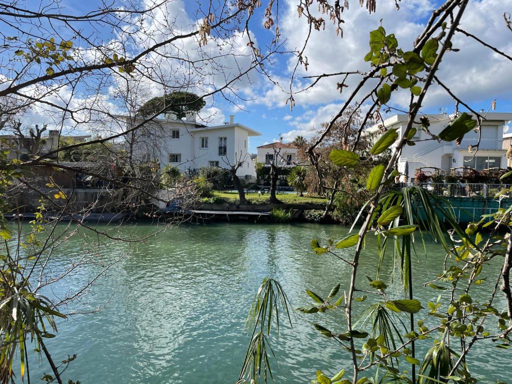 a view of a river with buildings in the background at Villa Louise-Rose in Villeneuve-Loubet