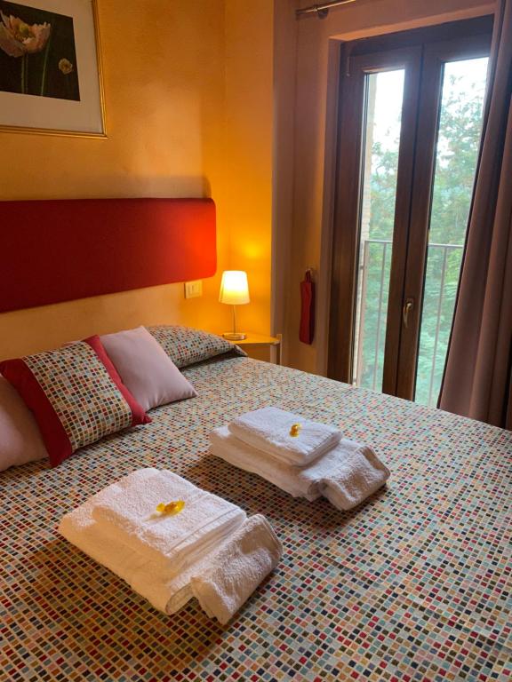 Posteľ alebo postele v izbe v ubytovaní Dolce Vita in Tuscany B&B