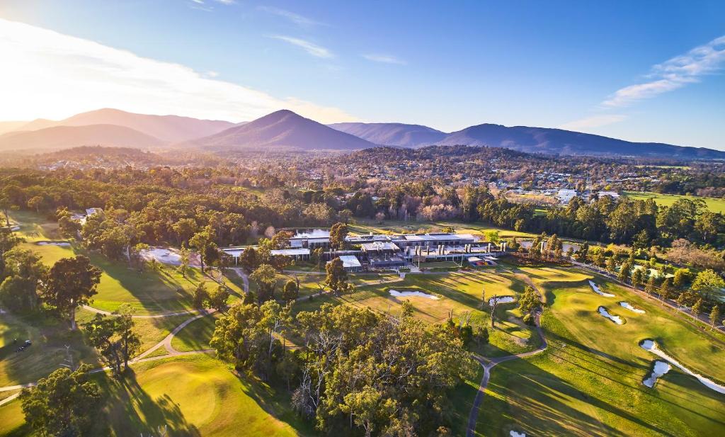 an aerial view of the resort with mountains in the background at RACV Healesville Country Club & Resort in Healesville