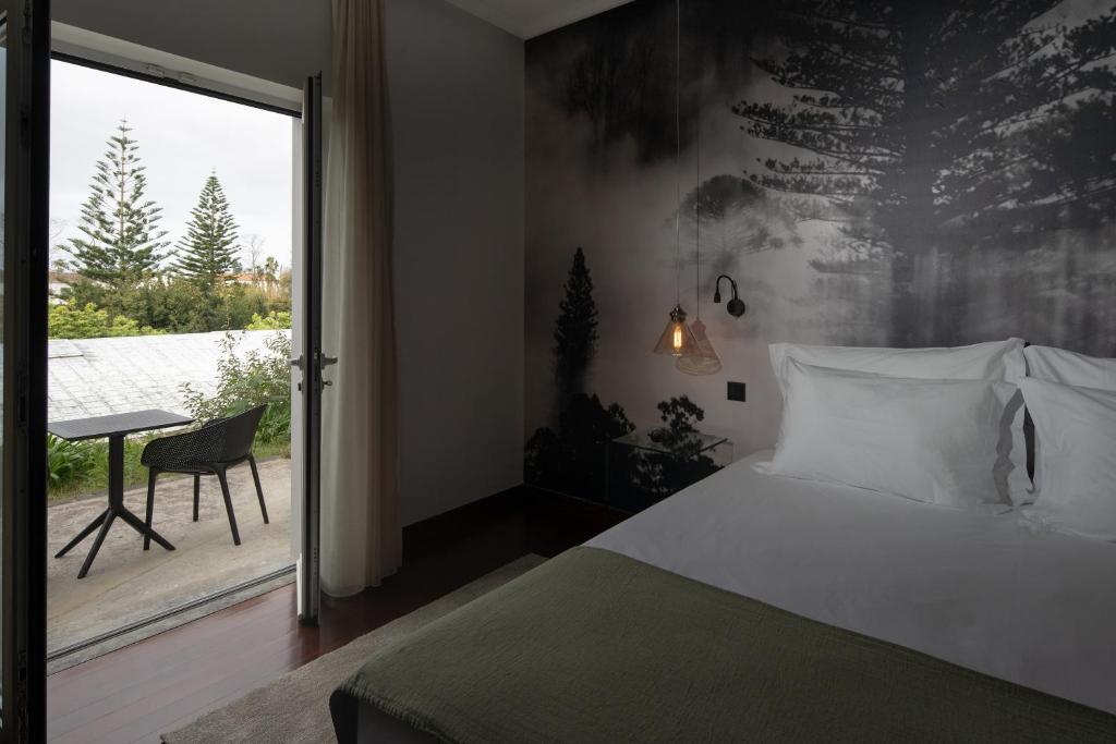 Postel nebo postele na pokoji v ubytování Senhora da Rosa, Tradition & Nature Hotel