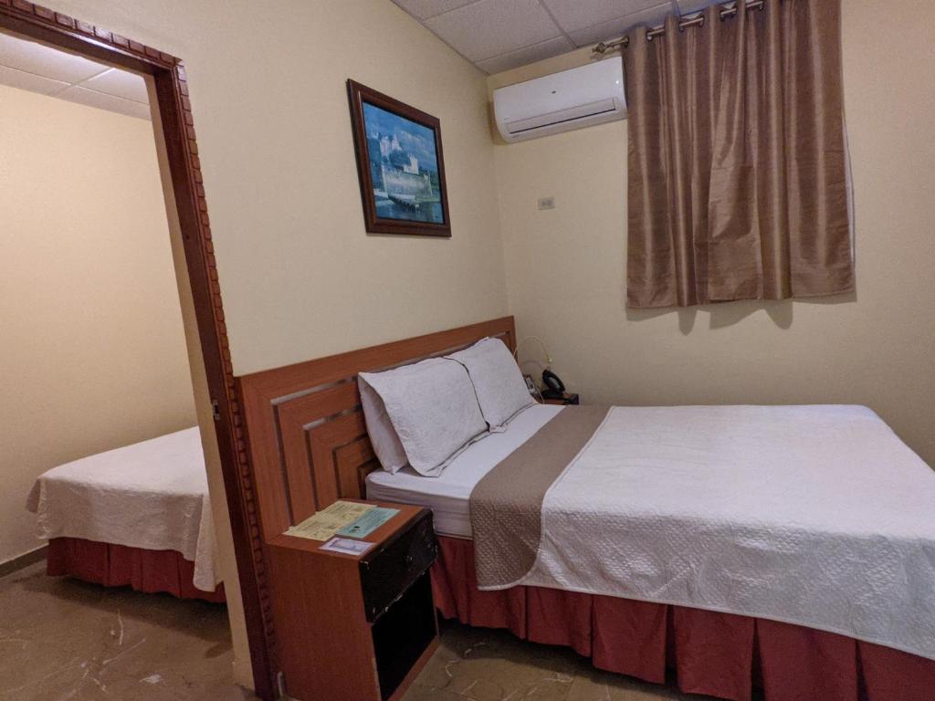 Postel nebo postele na pokoji v ubytování Hotel San Jorge