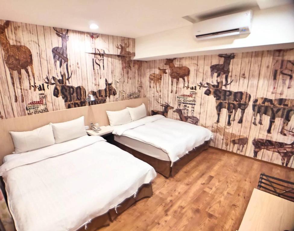 Postel nebo postele na pokoji v ubytování Sanduo Hotel