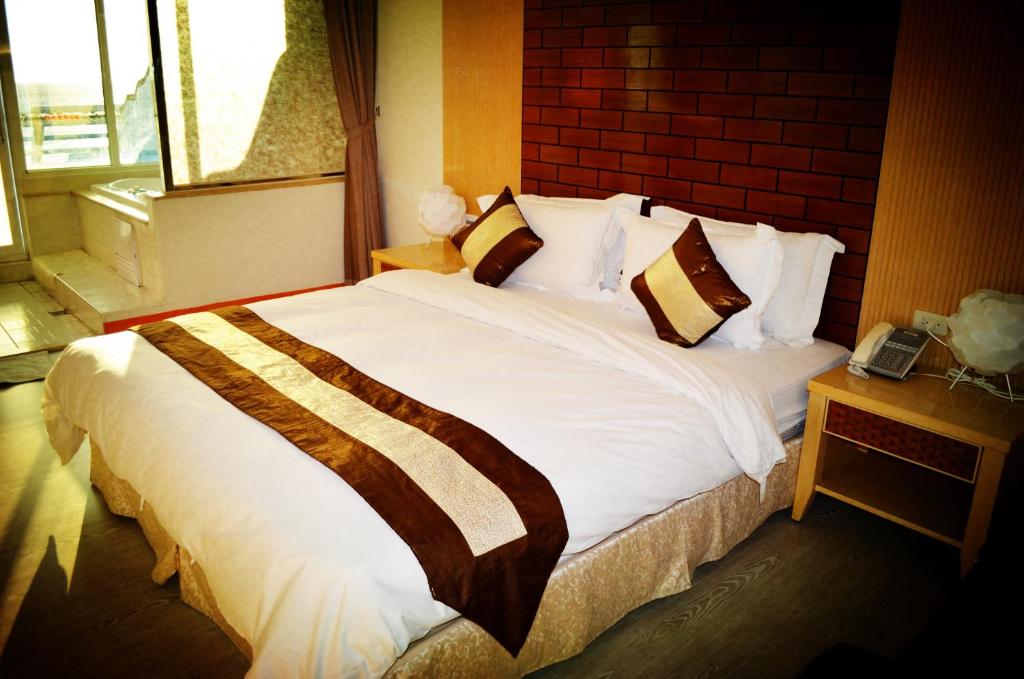 Postel nebo postele na pokoji v ubytování Yake Homestay