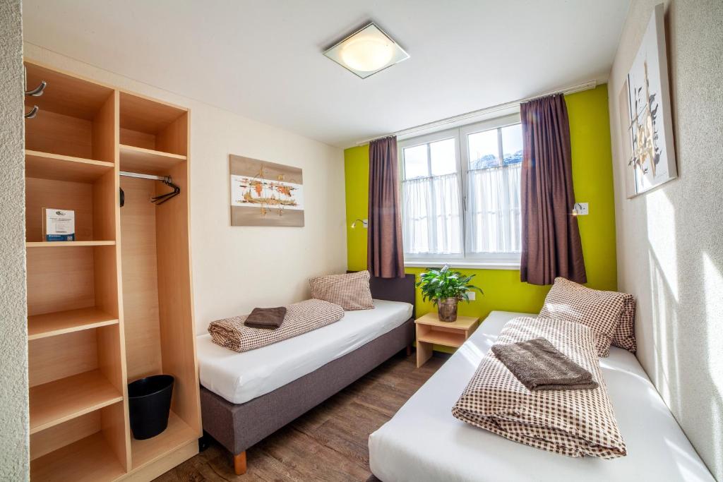 Postel nebo postele na pokoji v ubytování Rutsche Hostel