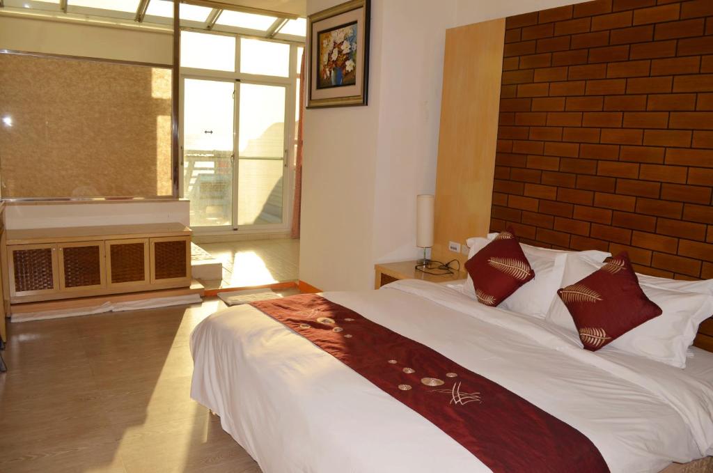 Postel nebo postele na pokoji v ubytování Yake Homestay