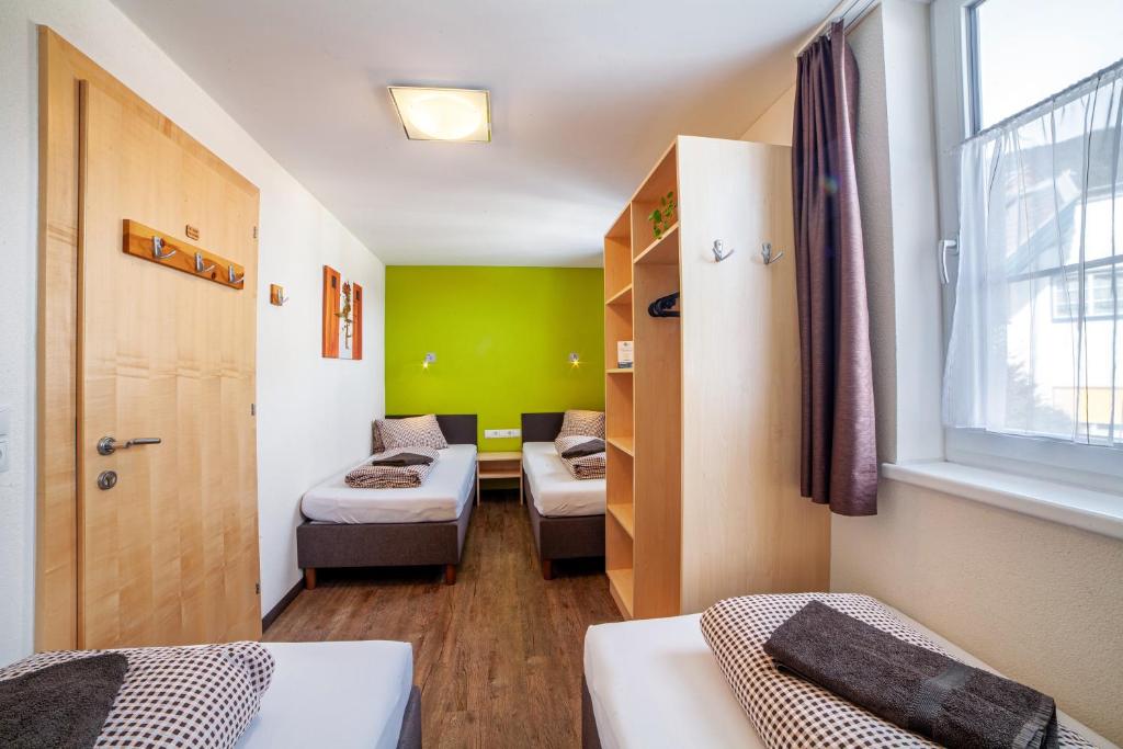 Postel nebo postele na pokoji v ubytování Rutsche Hostel