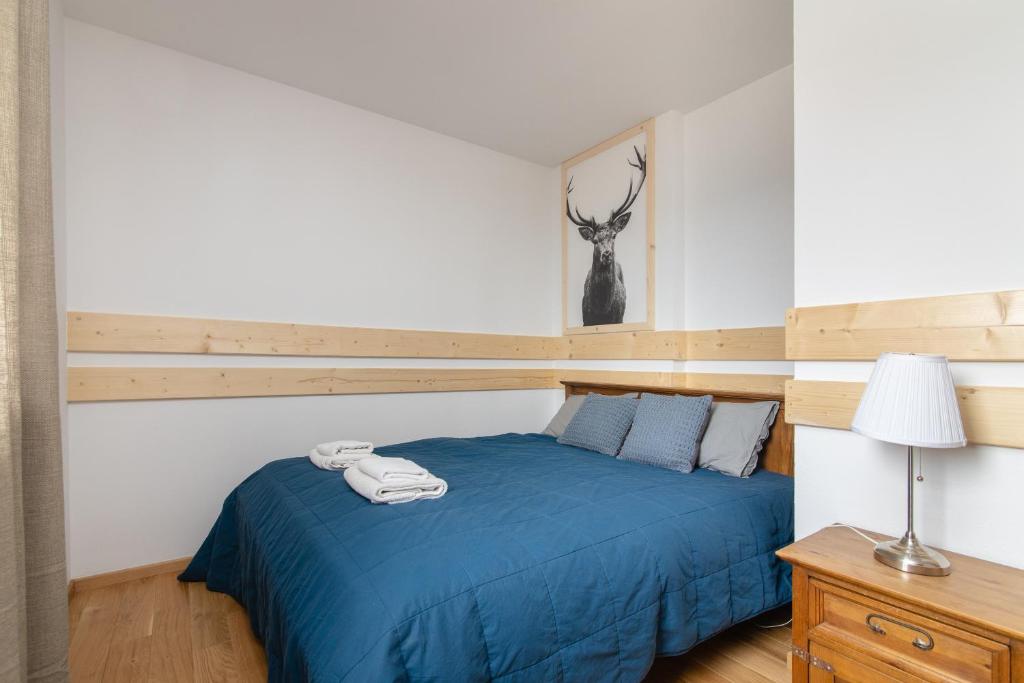Posteľ alebo postele v izbe v ubytovaní Apartamenty Domino - Kościelisko