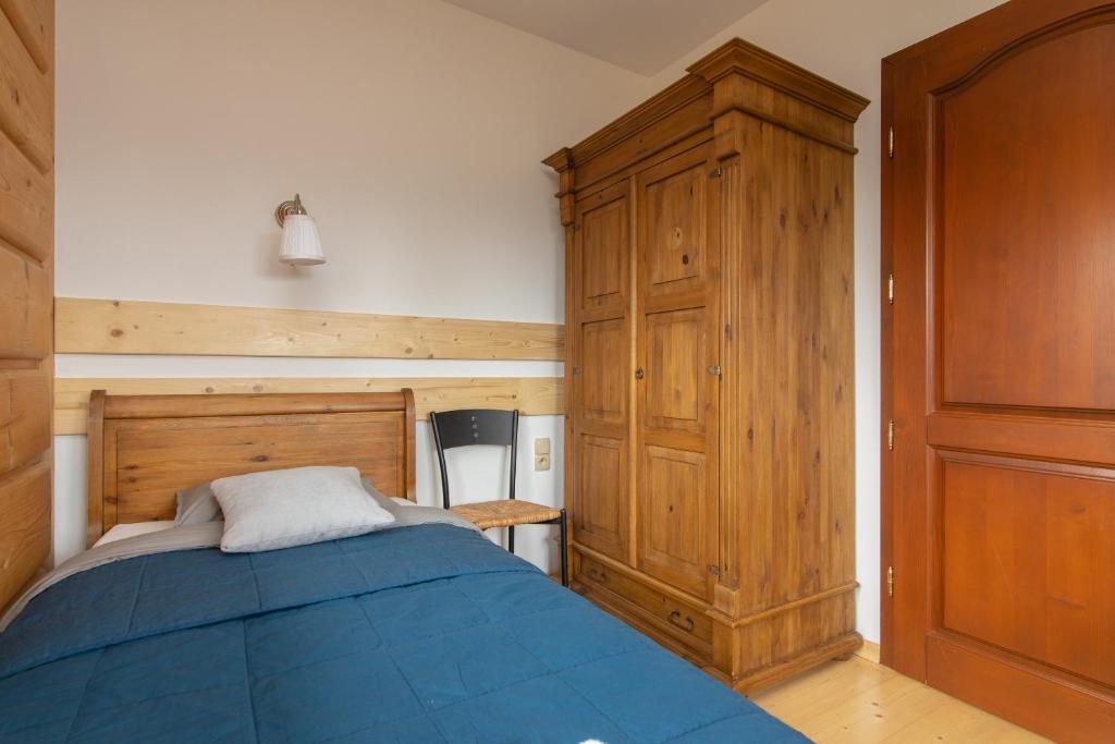 Posteľ alebo postele v izbe v ubytovaní Apartamenty Domino - Kościelisko