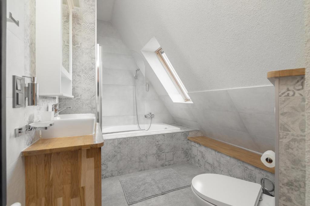 Kúpeľňa v ubytovaní Apartamenty Domino - Kościelisko
