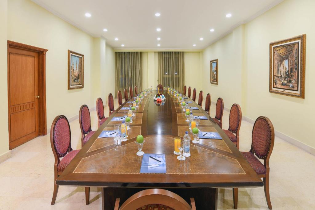 a long conference room with a long table and chairs at Tolip Aswan Hotel in Aswan