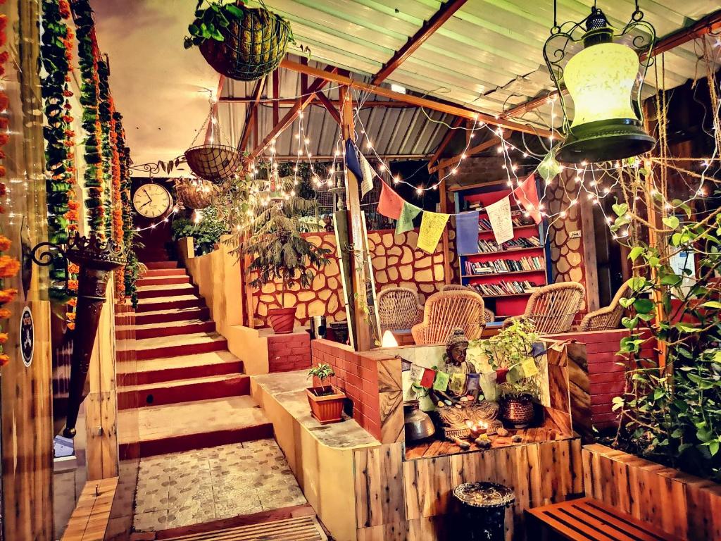 a store with stairs and plants and a clock at Hill Top Swiss Cottage in Rishīkesh