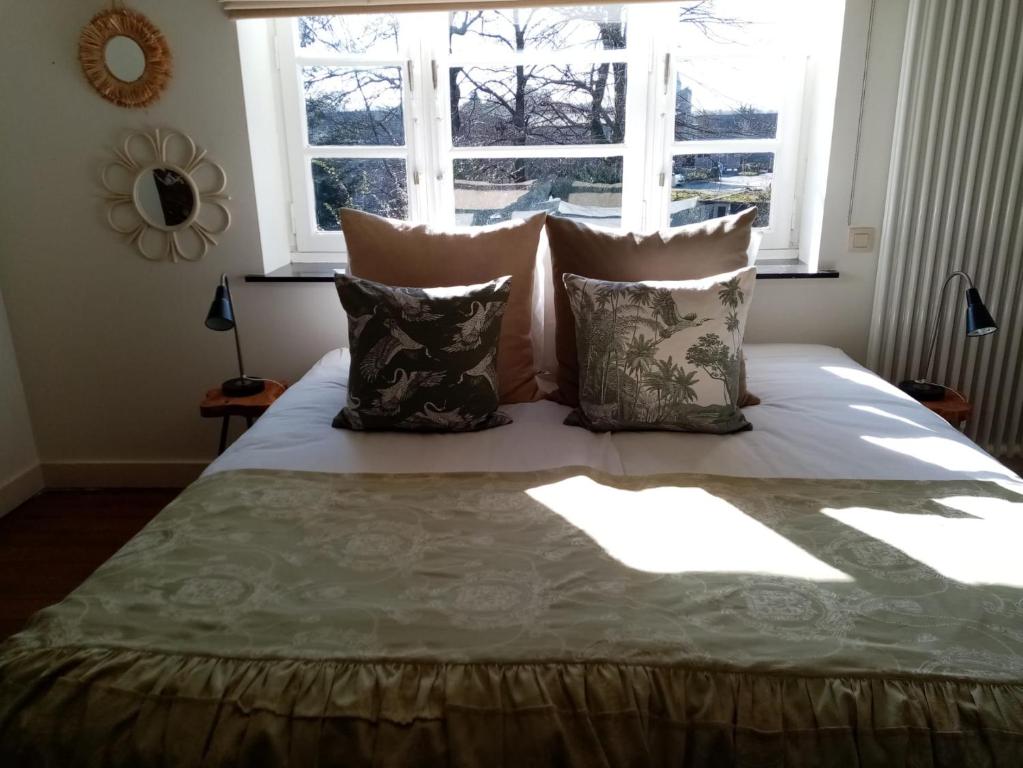 Postel nebo postele na pokoji v ubytování Vakantiewoning Guesthouse MOMO