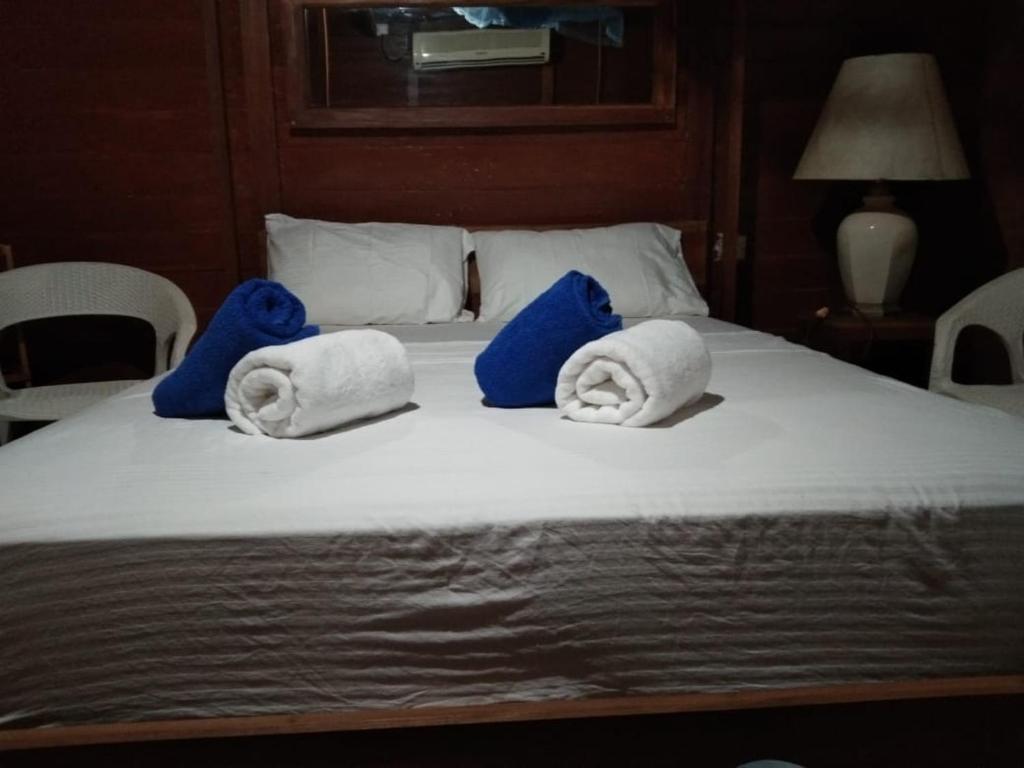 Postel nebo postele na pokoji v ubytování Hi Win Hotel