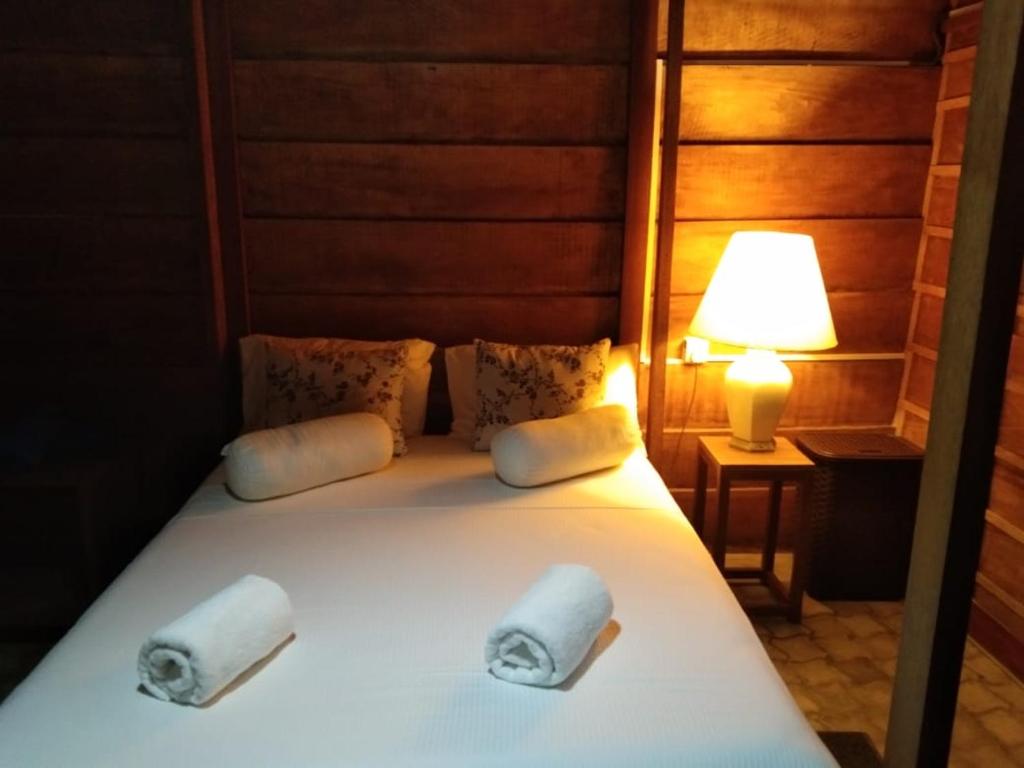 מיטה או מיטות בחדר ב-Hi Win Hotel