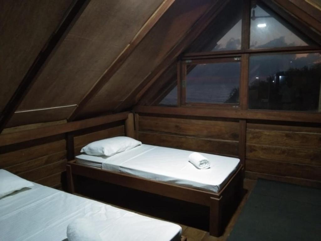 Postel nebo postele na pokoji v ubytování Hi Win Hotel