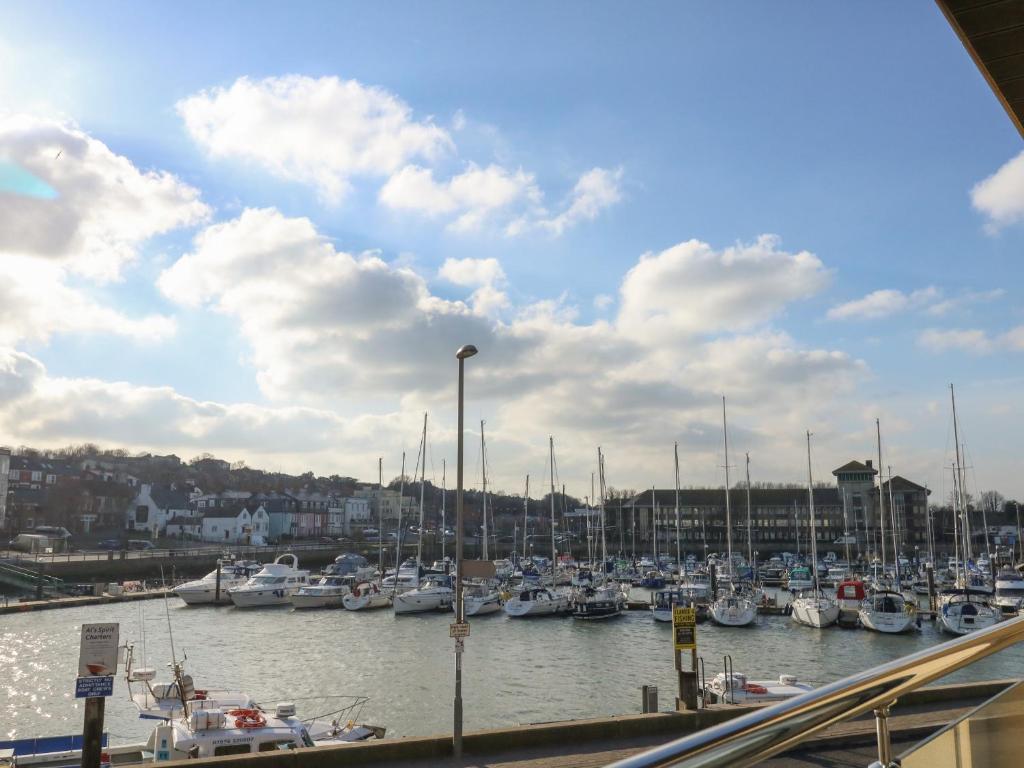 a harbor filled with lots of boats in the water at Harbourside Haven Apartment 1 in Weymouth