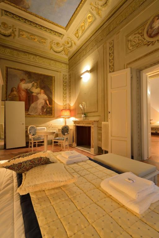 Postel nebo postele na pokoji v ubytování Palazzo Guicciardini