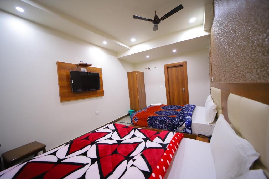 Postel nebo postele na pokoji v ubytování Hotel Royal Phoenix