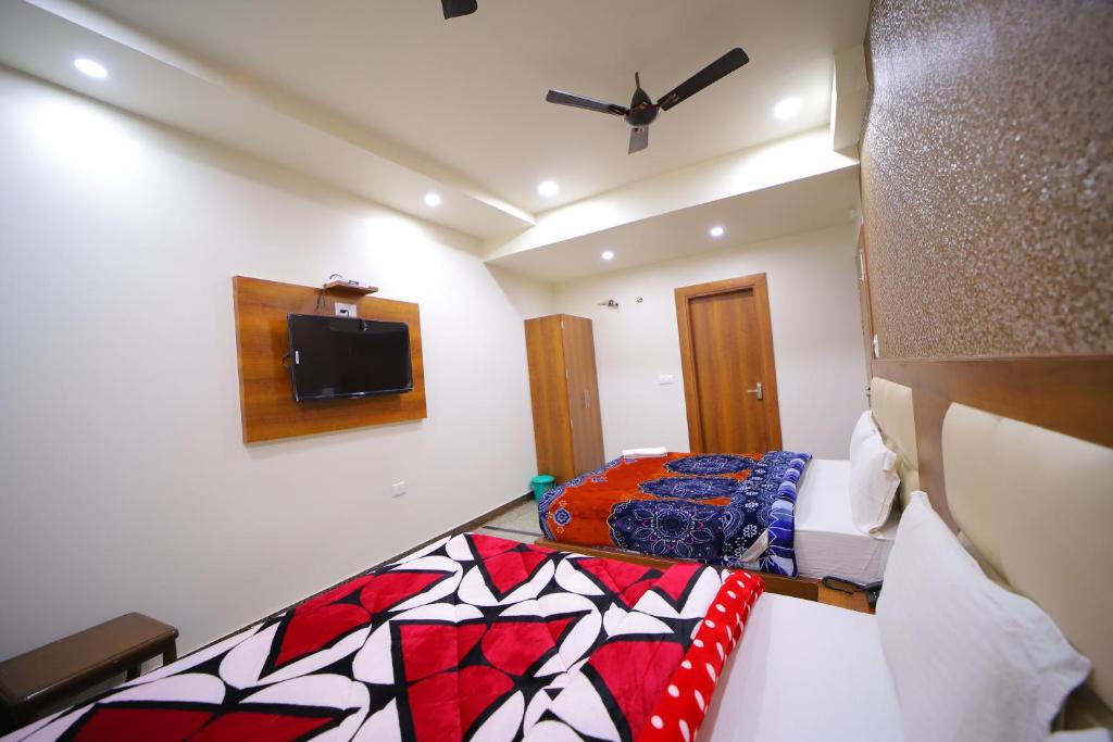 Postel nebo postele na pokoji v ubytování Hotel Royal Phoenix