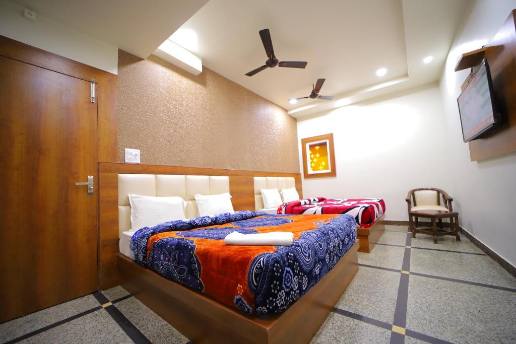Postel nebo postele na pokoji v ubytování Hotel Royal Phoenix