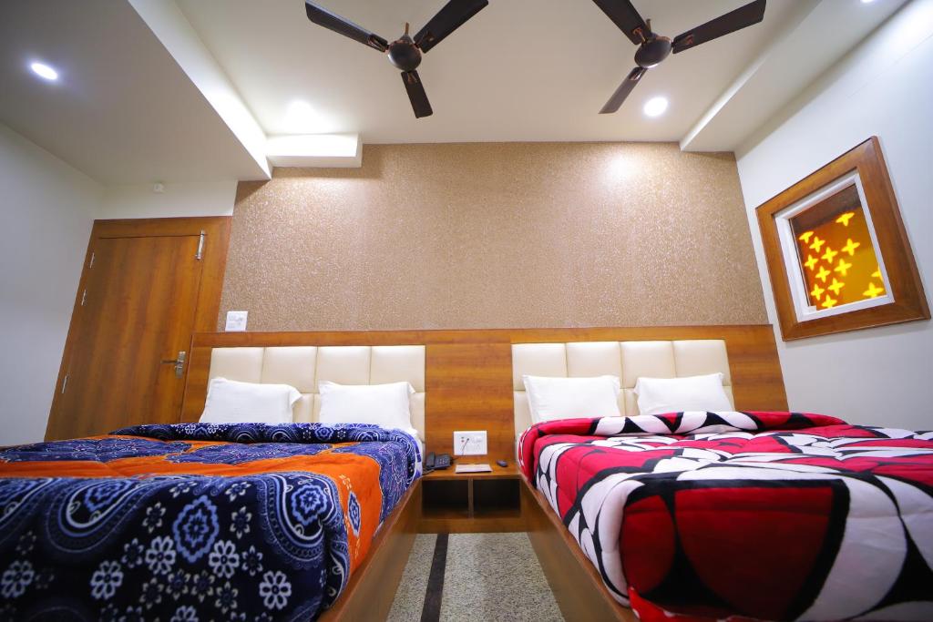 Postel nebo postele na pokoji v ubytování Hotel Royal Phoenix