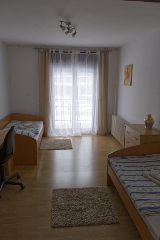 Postel nebo postele na pokoji v ubytování Gacka idila