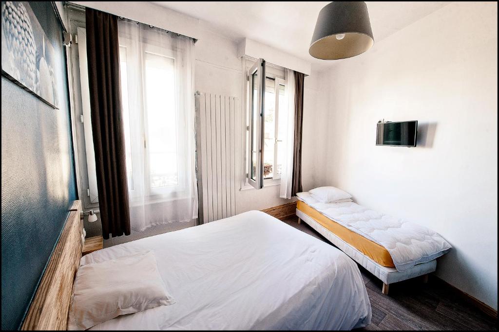 Postel nebo postele na pokoji v ubytování Hôtel du Nord