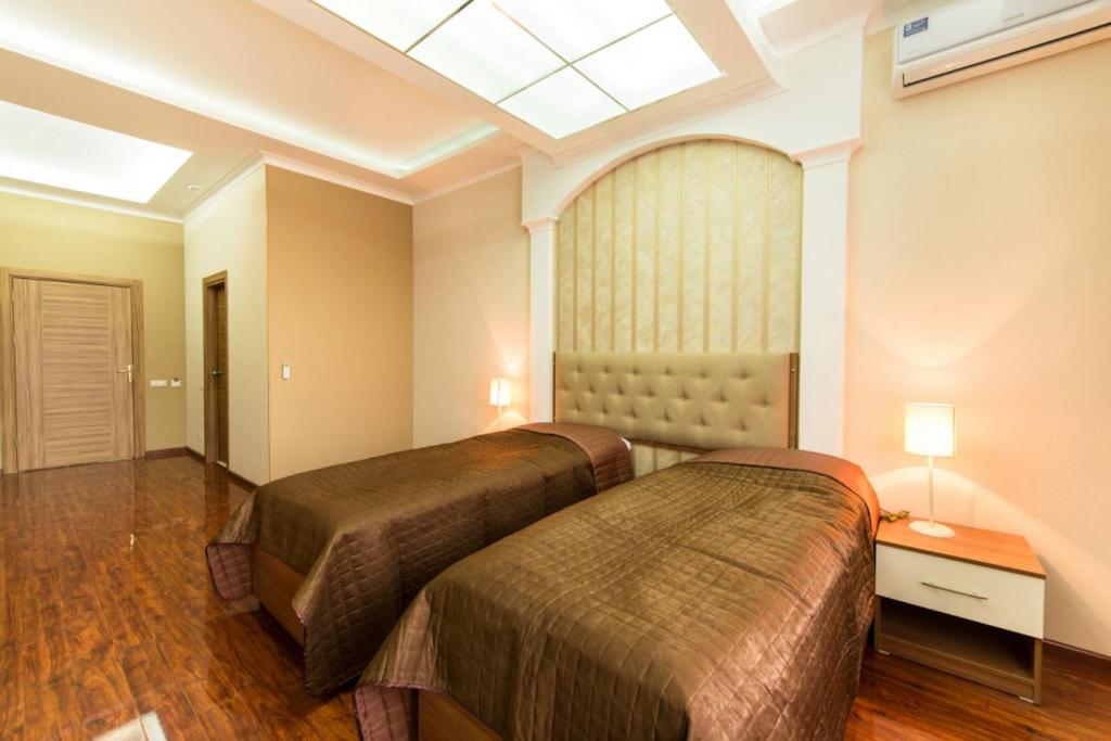 Кровать или кровати в номере Гостиница Альва Донна