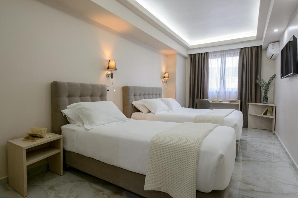 Letto o letti in una camera di Athens Starlight Hotel