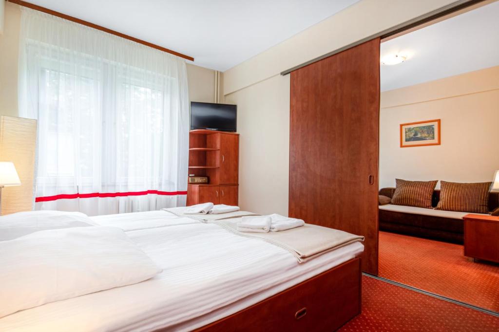 Postel nebo postele na pokoji v ubytování Hotel Ustka