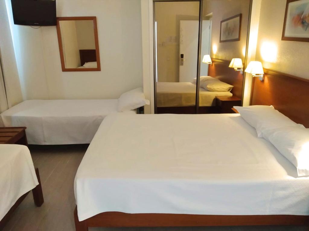 En eller flere senger på et rom på Hotel Sao Mamede Estoril