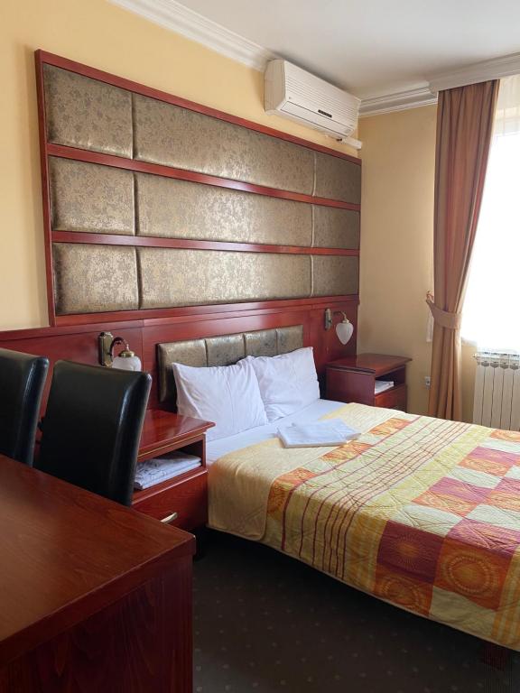 Postel nebo postele na pokoji v ubytování Hotel Kamel