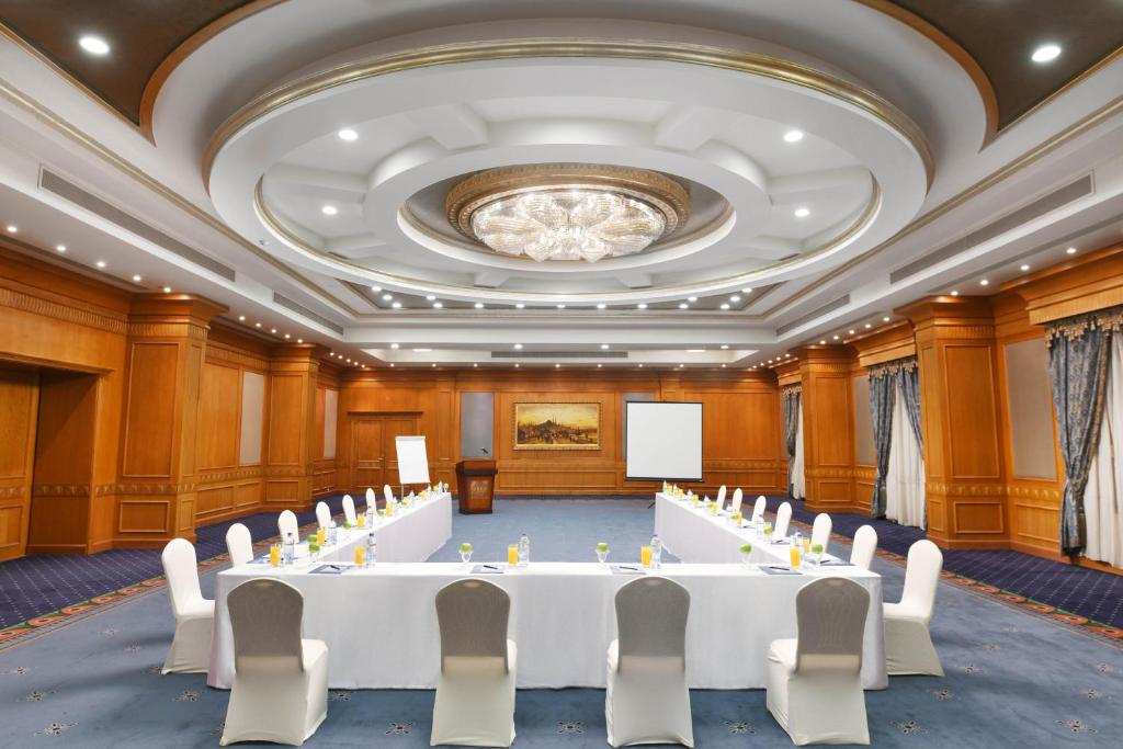 a conference room with a large white table and chairs at Tolip Aswan Hotel in Aswan