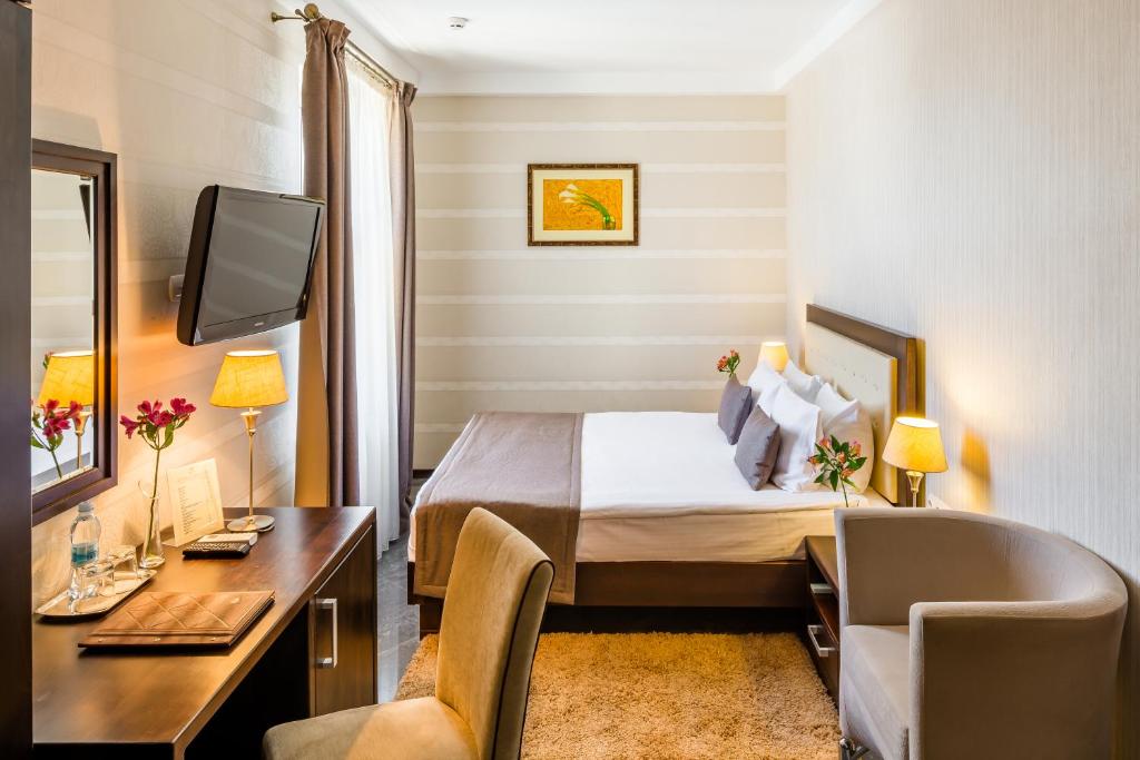 Ліжко або ліжка в номері Taurus Hotel & SPA