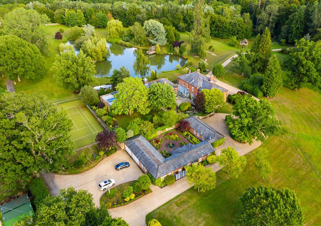 an aerial view of a large house with a garden at Cadnam Lodge in Cadnam